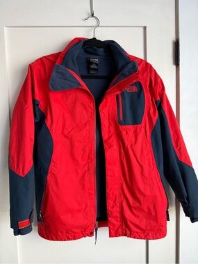 The North Face boys red and blue Hyvent jacket.